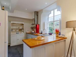 a kitchen with a wooden counter top and a window at 2 Bed in St Just 85610 in St Just +14 photos