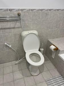 a bathroom with a toilet and a shower at Double room with shared bathoom in Auburn