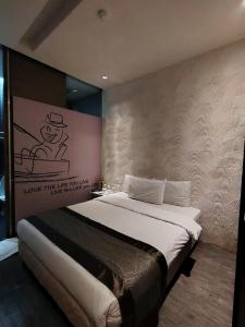 Ένα ή περισσότερα κρεβάτια σε δωμάτιο στο The Ardens Hotel - Danga Bay, Johor Bahru - Formerly Known As Zoom Inn Hotel