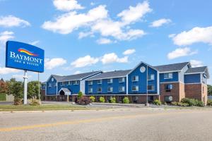 a blue building with a sign in front of it at Baymont by Wyndham Bloomington MSP Airport in Richfield