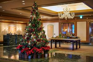 a christmas tree in the lobby of a hotel at Hotel Chinzanso Tokyo in Tokyo
