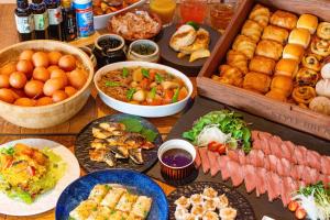 a table topped with lots of different types of food at HOTEL HILLARYS Akasaka in Tokyo