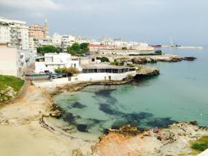 a body of water with buildings and a city at B&B Portorosso in Monopoli