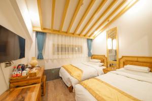 Postel nebo postele na pokoji v ubytování Pipa Hotel Datong