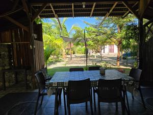 a table and chairs on the patio of a house at Amban Beach House in Manokwari