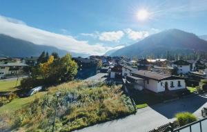 an aerial view of a town with a mountain at Mondschein Apart in Pertisau