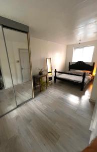 a bedroom with a mirror and a bed in a room at Blackthorne in Lichfield