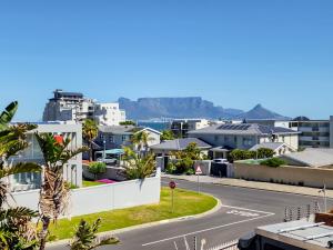 an empty street in a city with houses at 70 on Brander in Cape Town