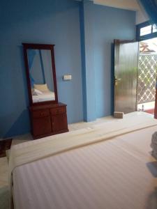 Postel nebo postele na pokoji v ubytování Ocean Moon Mirissa + 4 fotografie