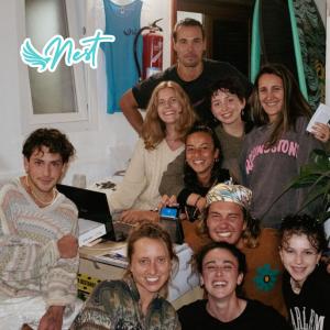 a group of people posing for a picture at Puerto Nest Hostel in Puerto de la Cruz