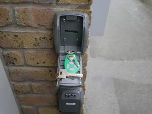 a cell phone is attached to a brick wall at Suite romantique Bali, Sauna , Spa in Strasbourg