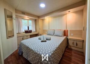 Ένα ή περισσότερα κρεβάτια σε δωμάτιο στο MyStay - MiKasa Bungalows