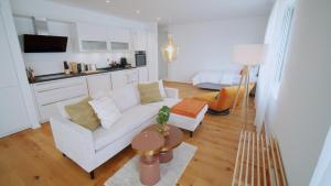 a living room with a white couch and a table at Boho Chic in Germering