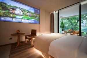 TV a/nebo společenská místnost v ubytování 大有观于All about Yu Hotel