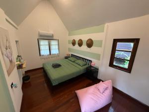 Postel nebo postele na pokoji v ubytování Vanara Bungalows
