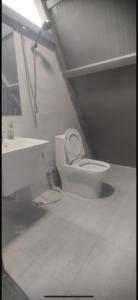 a bathroom with a toilet and a sink at Luna in Jāḩis +14 photos