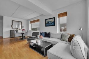 a living room with a couch and a table at Centrally located apartment in Tromsø in Tromsø