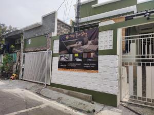 a building with a sign on the side of it at Alap Stay-Inn in Candi