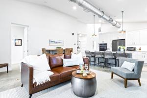 a living room with a brown couch and a table at 409 Washington Ave in Cape Canaveral