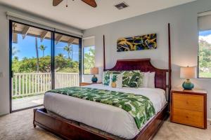 a bedroom with a large bed and a balcony at Grand Champions 124 · GC 124 3BD Wailea Condo wAC Pool Hot Tub in Wailea +60 photos