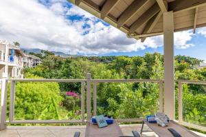 a patio with chairs and a view of trees at Grand Champions 124 · GC 124 3BD Wailea Condo wAC Pool Hot Tub in Wailea