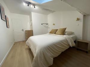 Katil atau katil-katil dalam bilik di Duplex appartement 70 m2