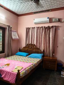 Voodi või voodid majutusasutuse Vallabhan Anex toas