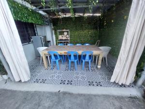 a table and chairs sitting on a patio at Hundred Islands lucky One Transient 3mins walk fr wharf in Alaminos