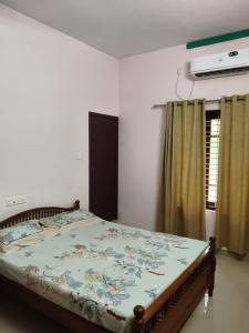 Voodi või voodid majutusasutuse Vallabhan Anex toas