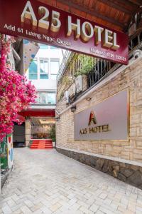 a sign for a hotel on the side of a building at A25 Hotel - 61 Lương Ngọc Quyến in Hanoi
