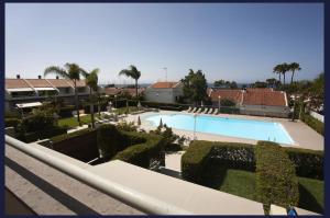 a view of a swimming pool from a building at Relax Blue Marlin Pasito Blanco in Pasito Blanco