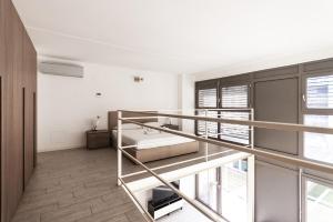 a bedroom with two bunk beds in a room at Youhosty - Bruno Maderna 17 Duplex in Milan