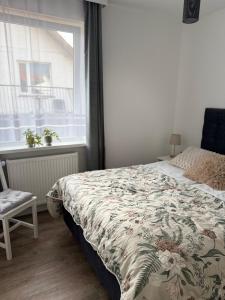 Una cama o camas en una habitación de Dom gościnny Ania, Apartament nr 7