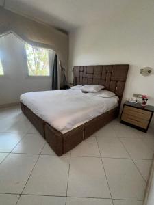 a bedroom with a large bed and a window at Sea View Apartment with Full kitchen and living room in Sharm El Sheikh