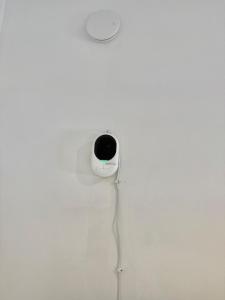 a white wall with a speaker on it at Stura Home in Rome