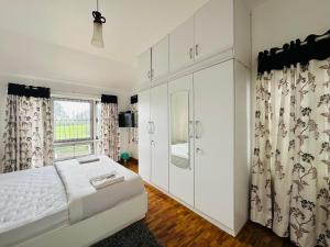 Postel nebo postele na pokoji v ubytování HAILSTONE HOME STAY