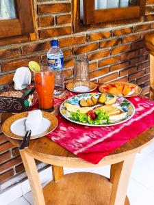 a table with plates of food on top of it at Pondok Bali Koempi in Ubud +27 photos
