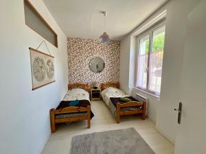 Un ou plusieurs lits dans un hébergement de l'établissement Family home le 31