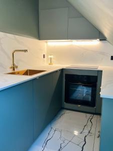 Kuchyň nebo kuchyňský kout v ubytování Chez Sandrine, mon appartement élégant + parking + 27 fotografií