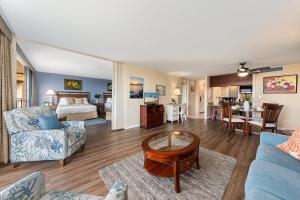 a living room with a couch and a table at Maui Kaanapali Villas 415 · MKV 415 Updated Condo w Ocean View a in Kahana