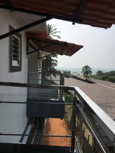 a balcony of a building with a view of the ocean at Antonio's hotel in Calangute