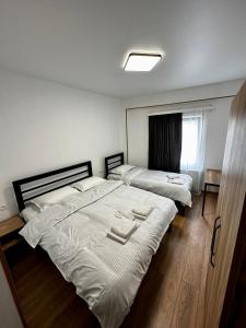 Postel nebo postele na pokoji v ubytování Mtskheta Family Stay