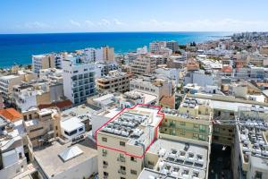 an aerial view of a city with the ocean at Downtown Sea View Penthouse in Larnaca