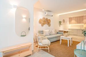 a living room with a couch and a table at GuestReady - Condessa Flores Apartments in Lisbon