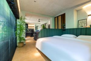 Ένα ή περισσότερα κρεβάτια σε δωμάτιο στο Heidi Garden Homestay