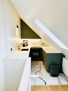 Kuchyň nebo kuchyňský kout v ubytování Chez Sandrine, mon appartement élégant + parking