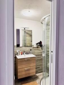 a bathroom with a sink and a shower at B&B Nonna Cristina in Nardodipace