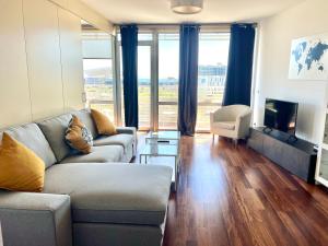 a living room with a couch and a tv at Ral48 in Sant Adria de Besos
