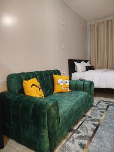 Ένα ή περισσότερα κρεβάτια σε δωμάτιο στο Chacha Homes Kiambu Road