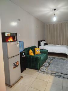 Ένα ή περισσότερα κρεβάτια σε δωμάτιο στο Chacha Homes Kiambu Road